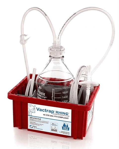 Laboratory setup with beaker and pipettes in a red container labeled 'Vactrap RHINO'.